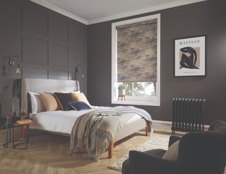 A bedroom wall panel painted in charcoal grey