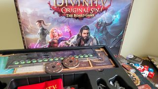 The Divinity Original Sin: The Board Game box and contents against a white surface