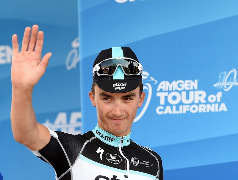 Julian Alaphilippe (Etixx-Quick Step) waves from the podium