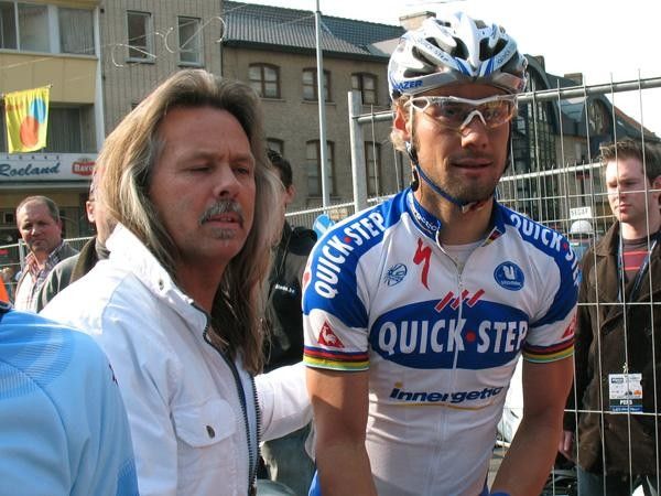 Tom Boonen has his personal bodyguard to get him safely out of the mass in Wevelgem