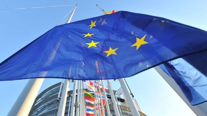 European flags fly in front of the European Parliament