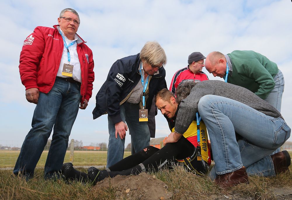 Tom Boonen of Omega Pharma-Quick Step and Belgium lies on the ground injured after crashing in 2013.