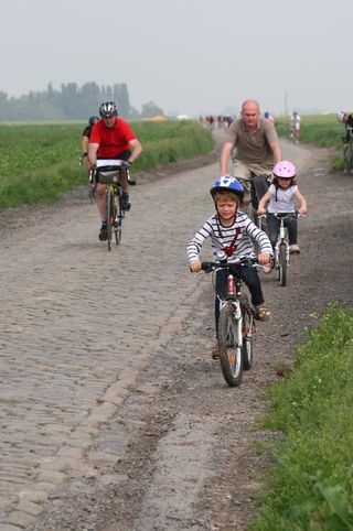 Family cycling enjoy a bike ride with your kids