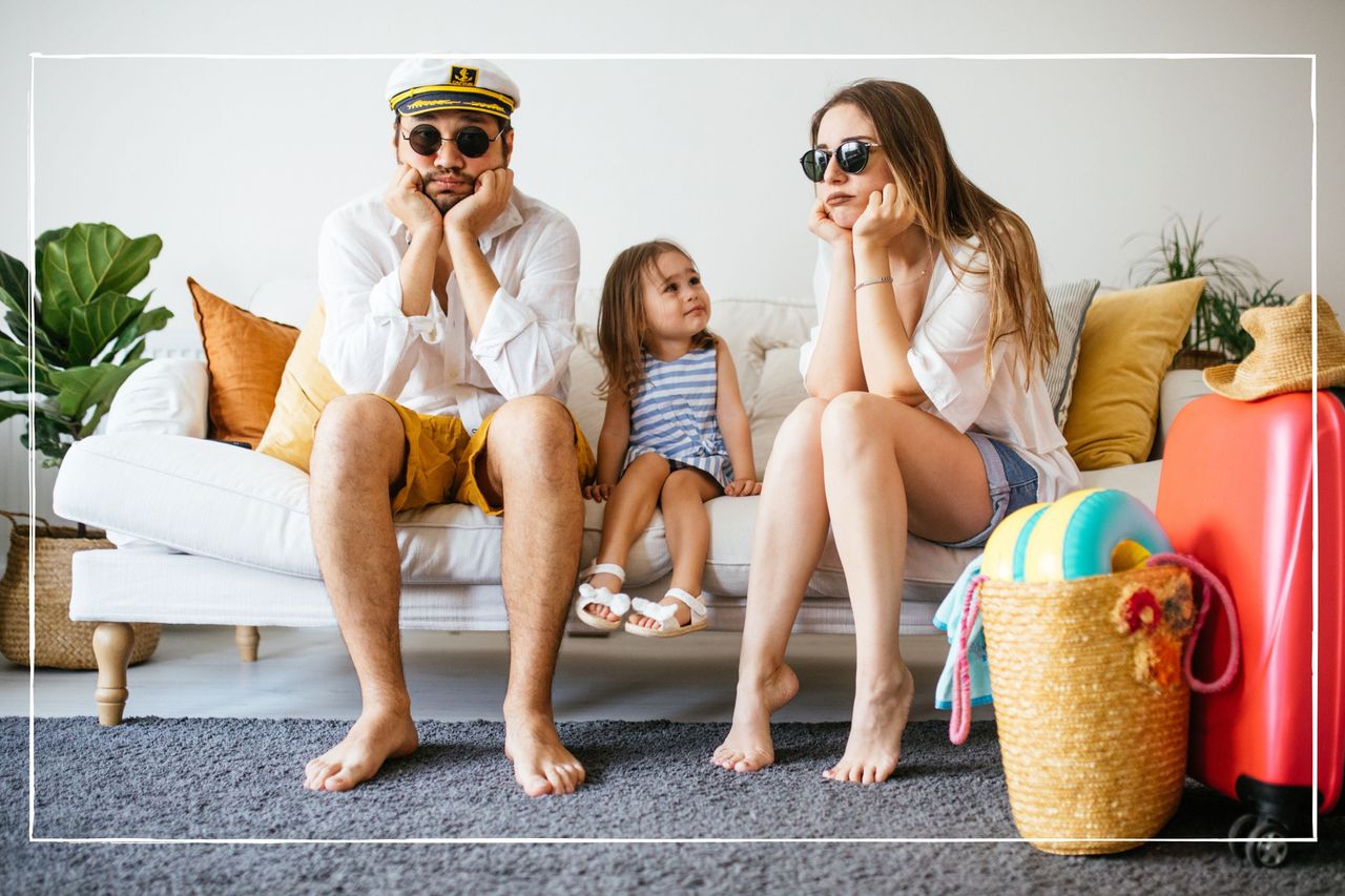 family ready for holiday looking sad while sat on a sofa