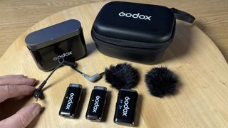 Godox WEC microphone laid out on a wooden table