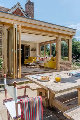 Outdoor trestle table and glass room