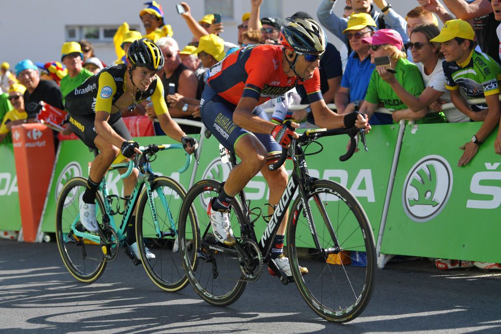 Vincenzo Nibali leads Primoz Roglic to the line