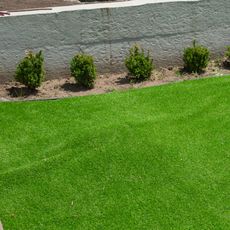artificial lawn showing signs of buckling and bulging