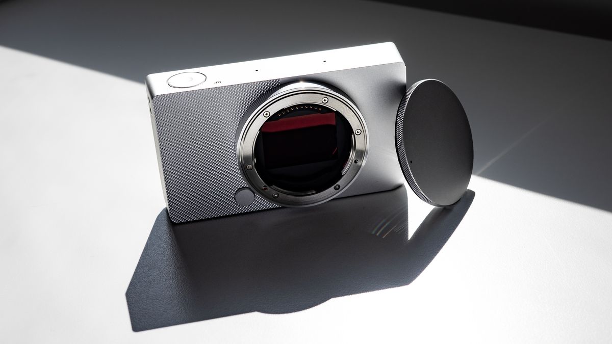 Sigma BF with its body cap, on a white surface in strong light, with defined shadows