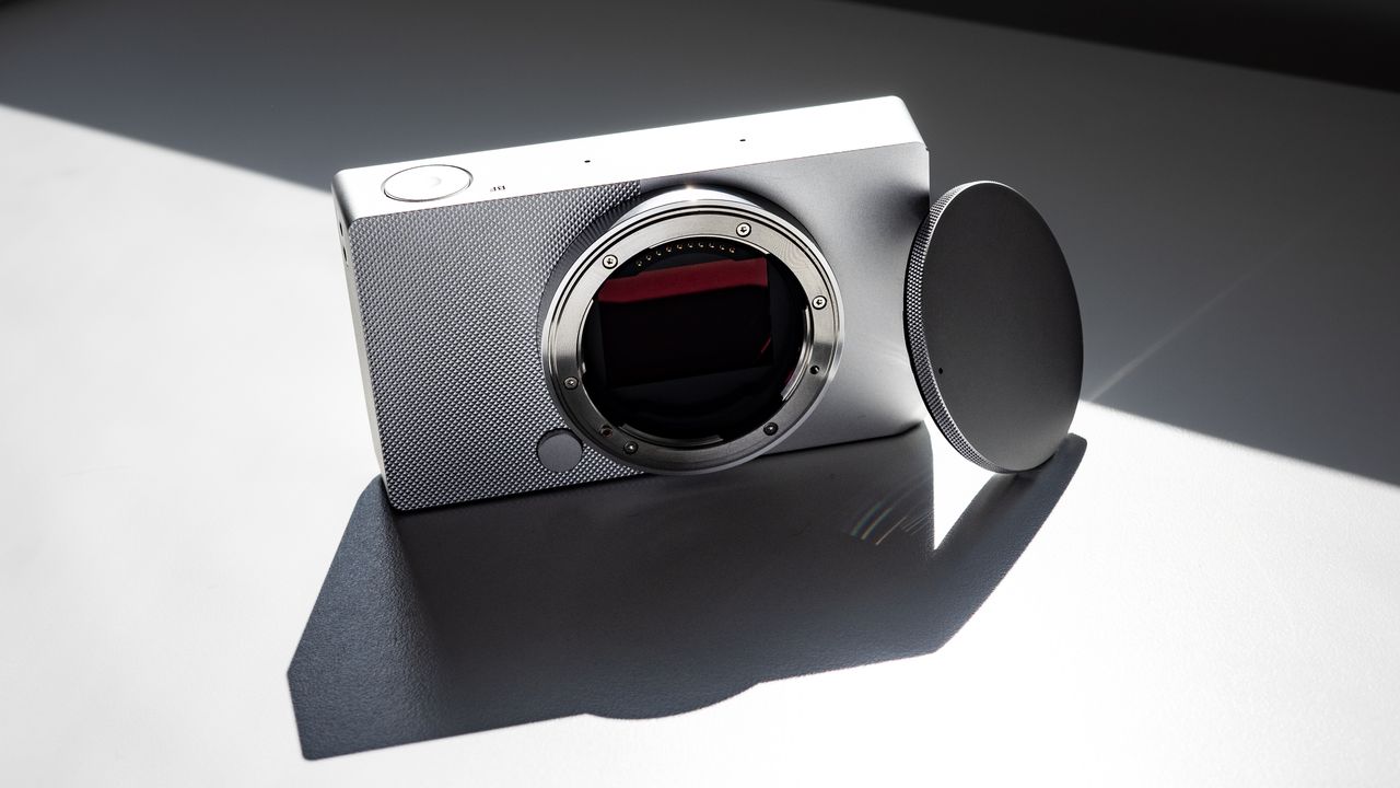 Sigma BF with its body cap, on a white surface in strong light, with defined shadows