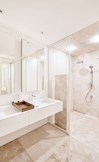 Bathroom with walk in shower and double basin
