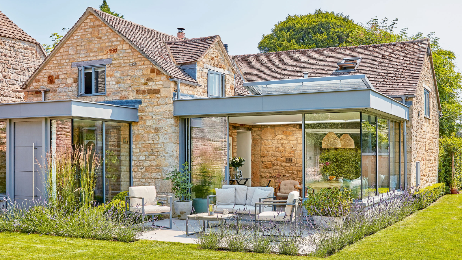 A stone cottage with glass box extension to extend the ground floor as well as link the cottage areas more effectively