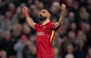 Mohamed Salah celebrates scoring the team's second goal during the English Premier League football match between Liverpool and Brighton and Hove Albion at Anfield in Liverpool, north west England on November 2, 2024.