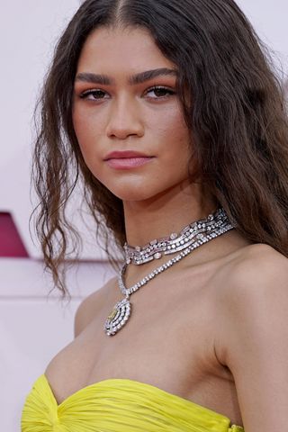 Zendaya, necklace detail, attends the 93rd Annual Academy Awards at Union Station on April 25, 2021 in Los Angeles, California.