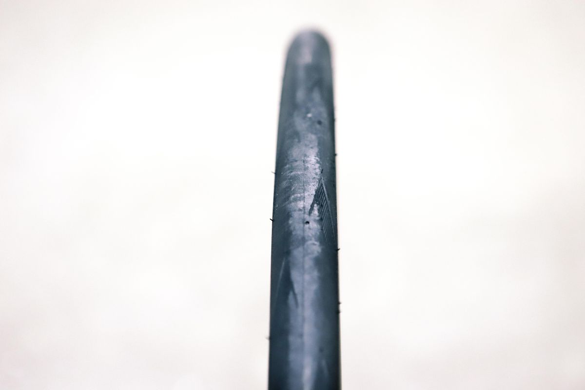 a close up of a black road bike tyre