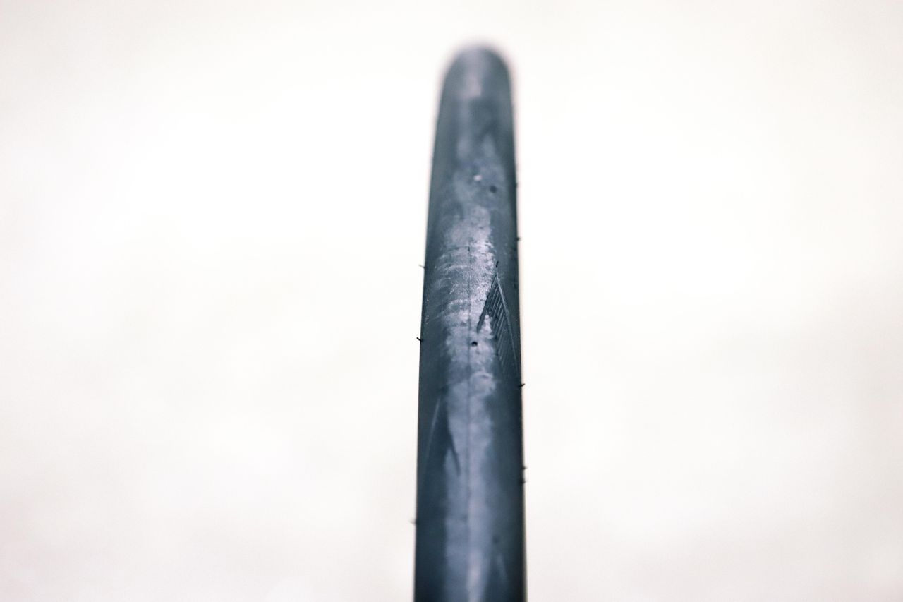 a close up of a black road bike tyre