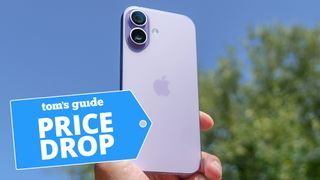 iPhone 17 held up in the air against blue sky