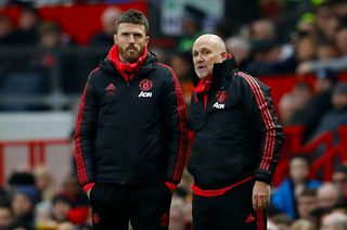 Manchester United coaches Michael Carrick, left, and Mike Phelan were not in the dugout at Old Trafford