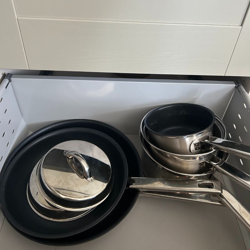 John Lewis Classic 5 Piece Pan Set stacked in drawer
