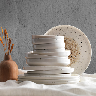 A collection of hand thrown dinner plates 