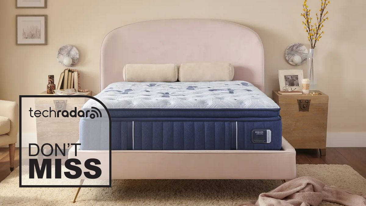 A Stearns &amp; Foster Estate mattress with a pillow-top on a bed frame, with a TechRadar deals graphic