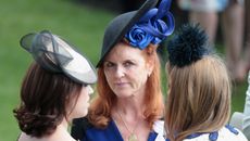 Princess Eugenie, Sarah Ferguson, Duchess of York and Princess Beatrice hold hands in the parade ring on day 4 of Royal Ascot at Ascot Racecourse on June 19, 2015 in Ascot, England.