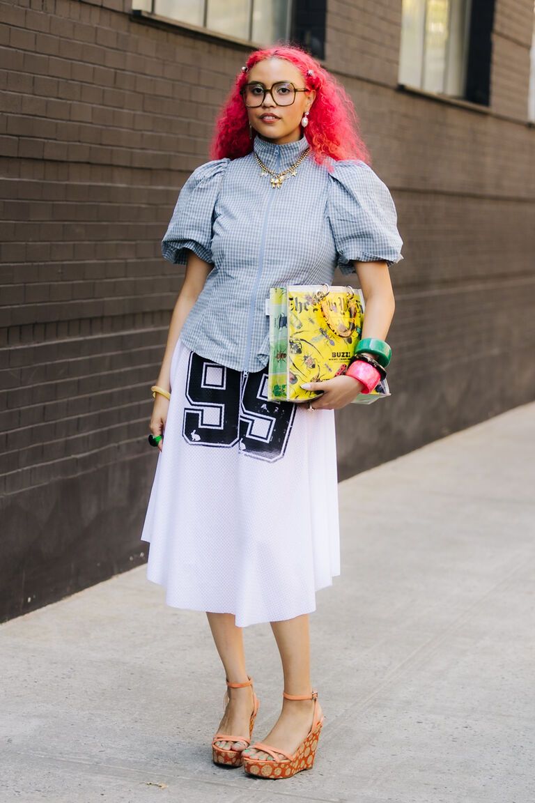 women at fashion week wearing the summer jewelry trend 2026 of stacks of bangles on their wrists