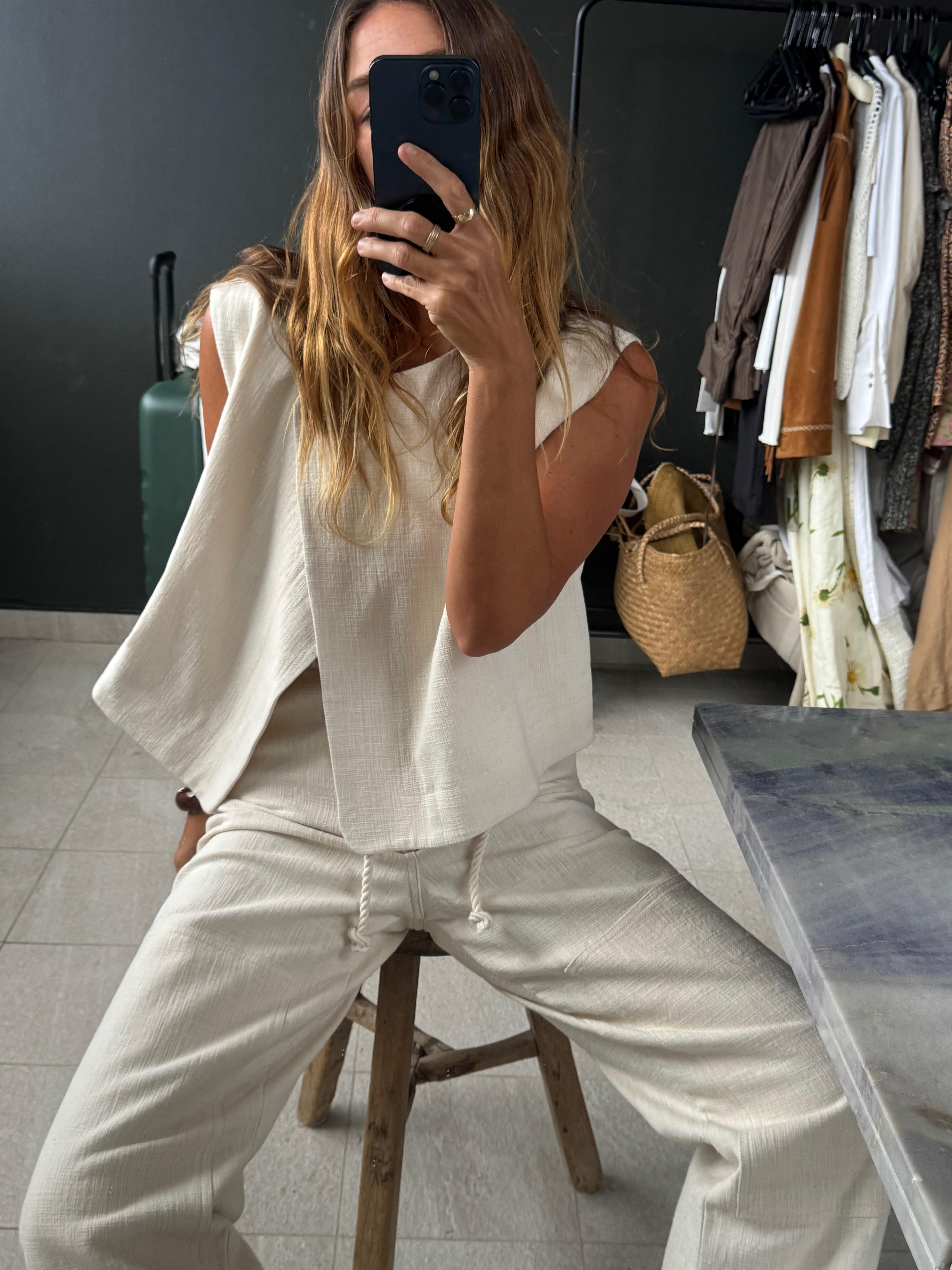 Angie wears a jacket from Sézane.
