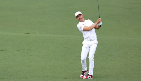 Camilo Villegas strikes a wedge shot at Augusta National