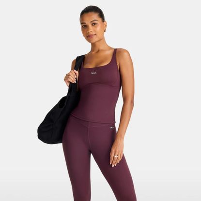 tala model wearing dark cherry tank exercise top