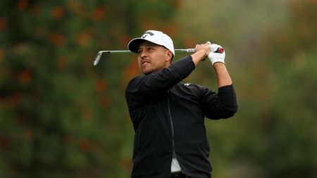 Xander Schauffele hits a shot during R3 of the 2024 Genesis Invitational