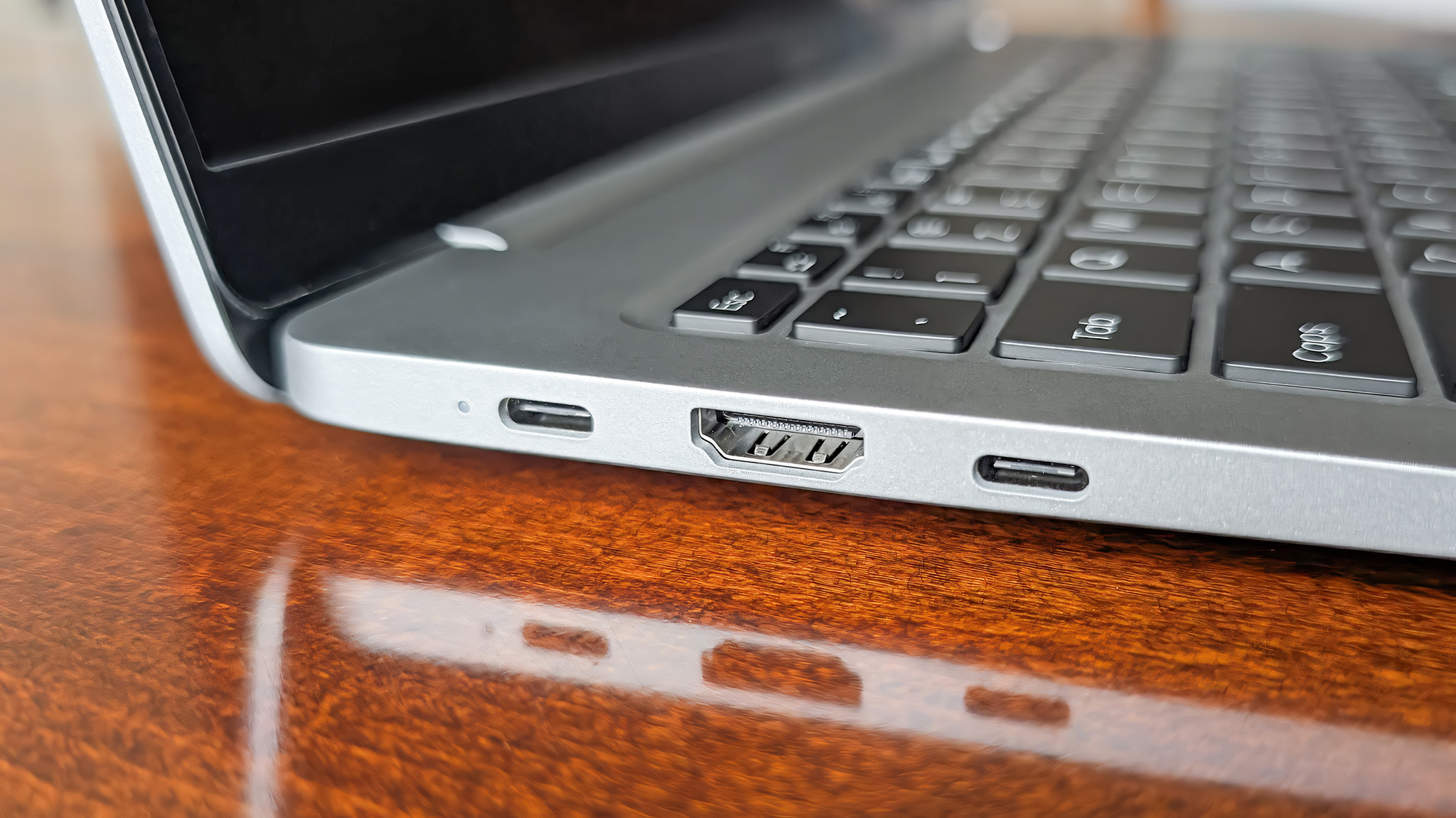 Closeup of the two USB-C ports and HDMI port on the Geekom GeekBook X16 Pro's right side. 