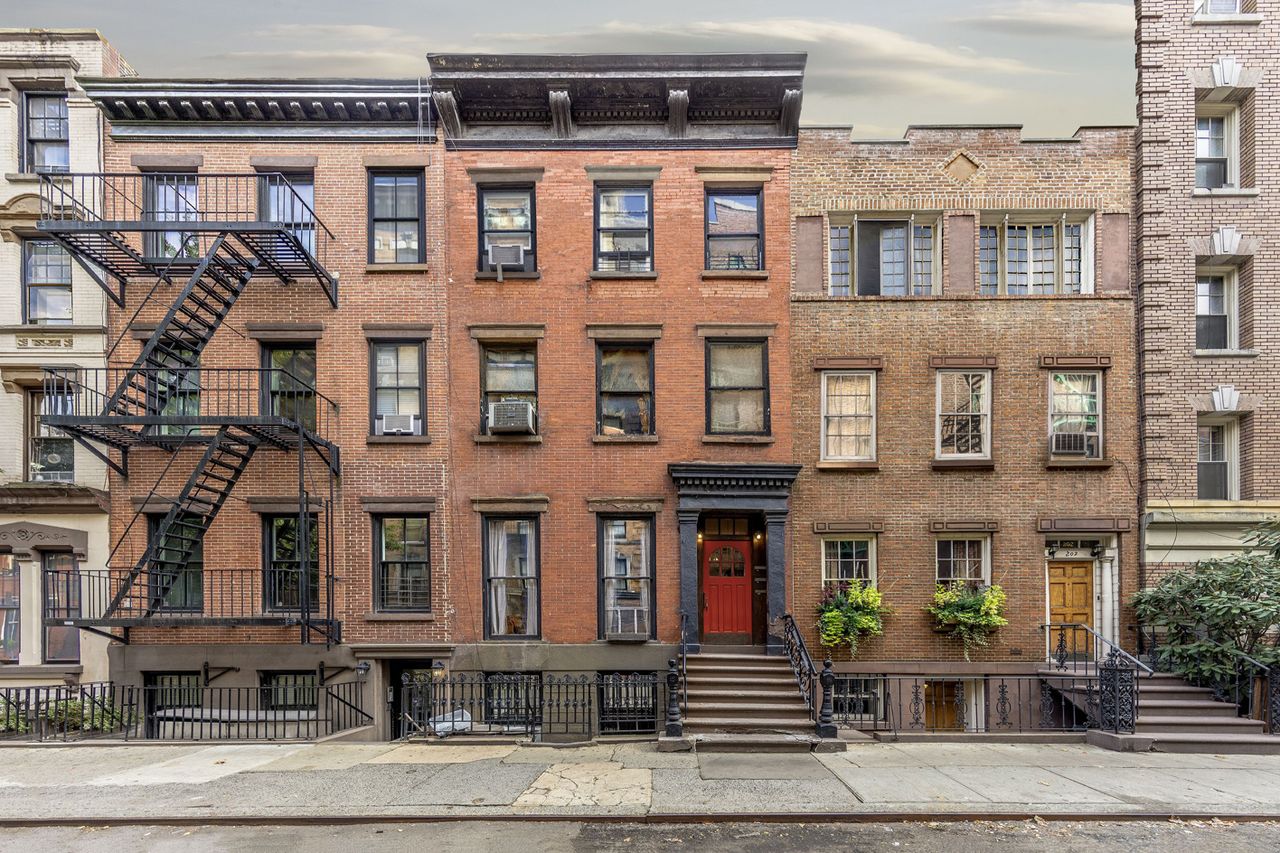 Three joint brick buildings with black exterior staircase