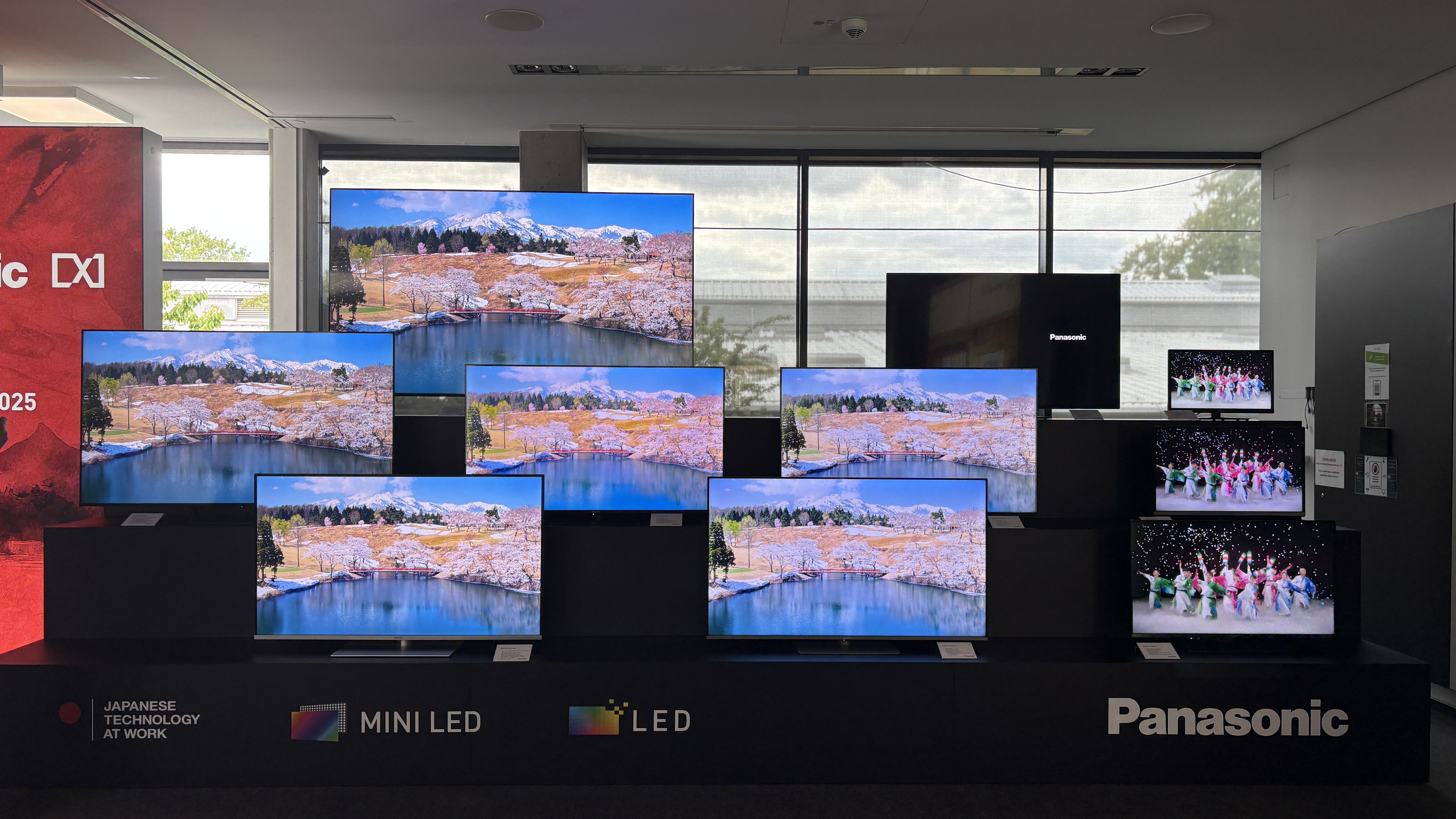 Panasonic TVs on a black show stand