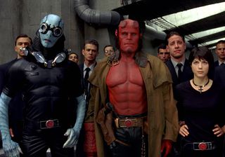 Ron Perlman leads a group of fellow creatures and men in suits