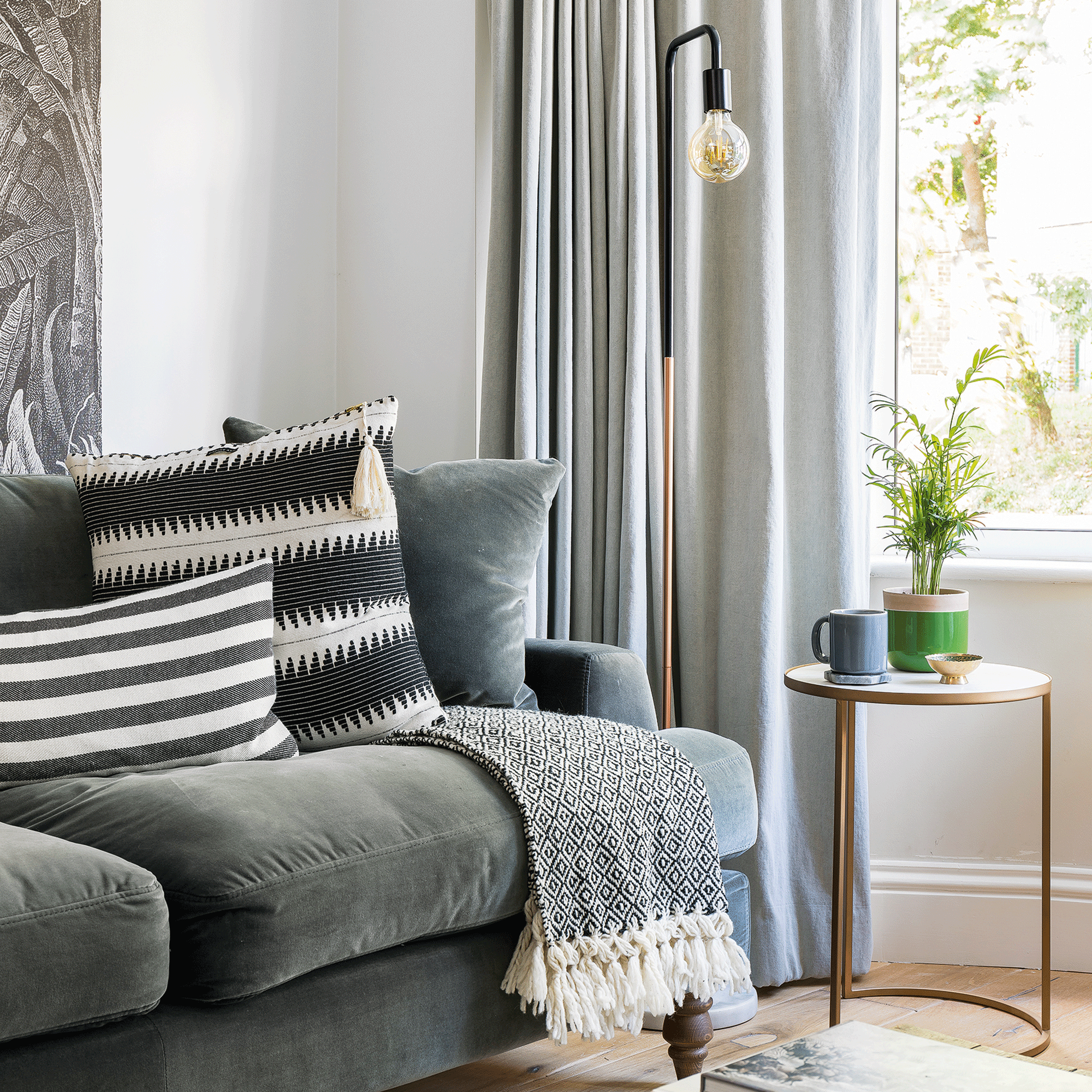 Grey velvet sofa in white living room