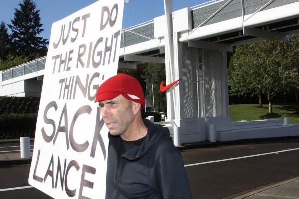 Oregon race promoter Jeff Micthem protests Nike's support of Lance Armstrong in front of the Nike World Headquarters campus in Beaverton, Oregon, on Oct. 16, 2012