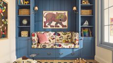 a nursery playroom space with blue custom built in bench seat in a vibrant upholstered fabric, shelves, drawers, and cabinetry with a large abstract leopard painting and toys