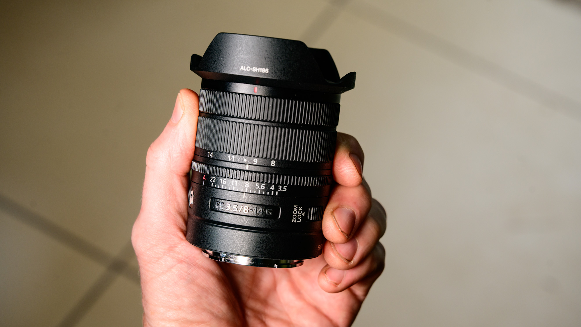 Sony FE 8-14mm F3.5 G fisheye lens in user's hand