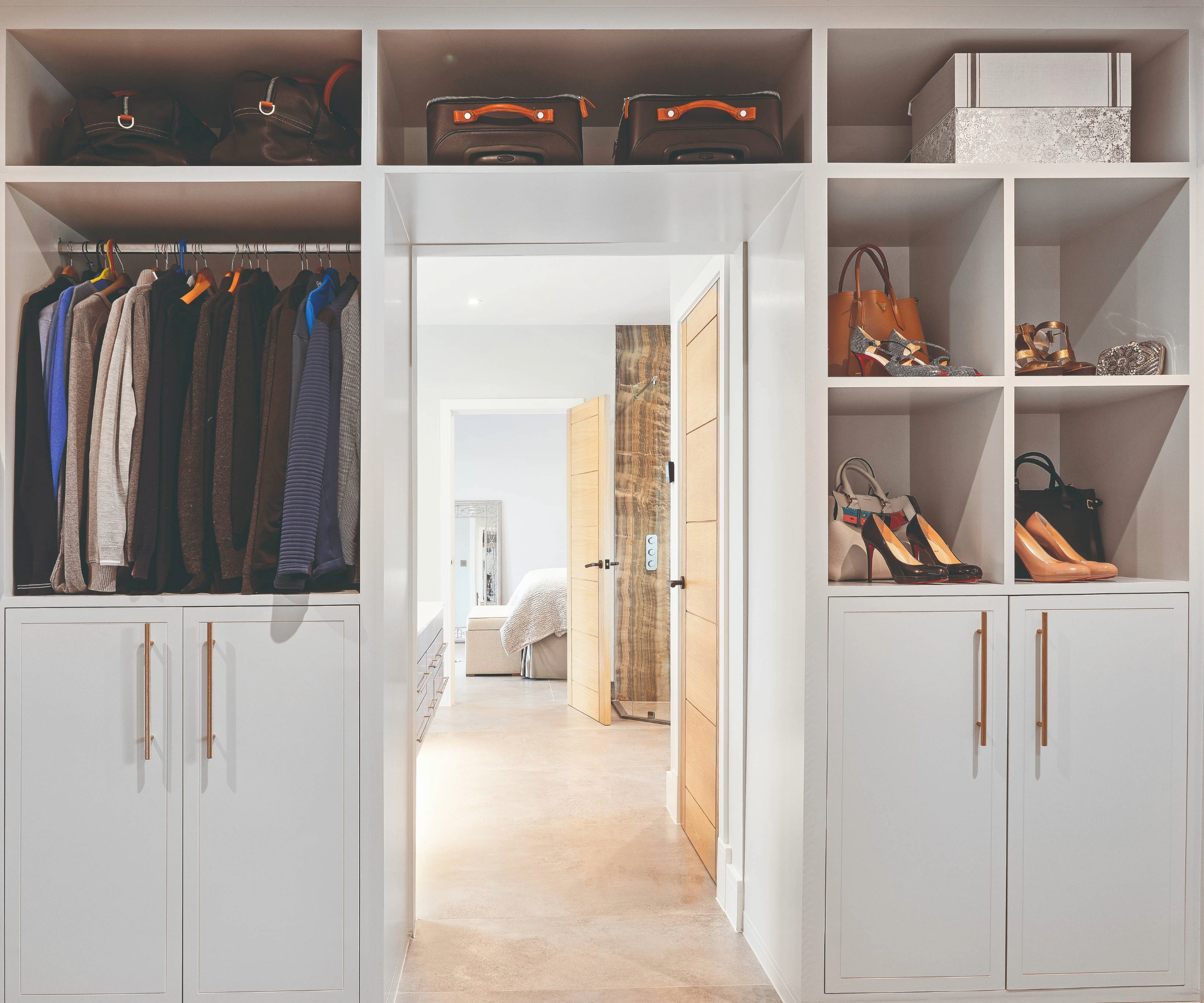 Dressing room with wardrobe built around the doorway
