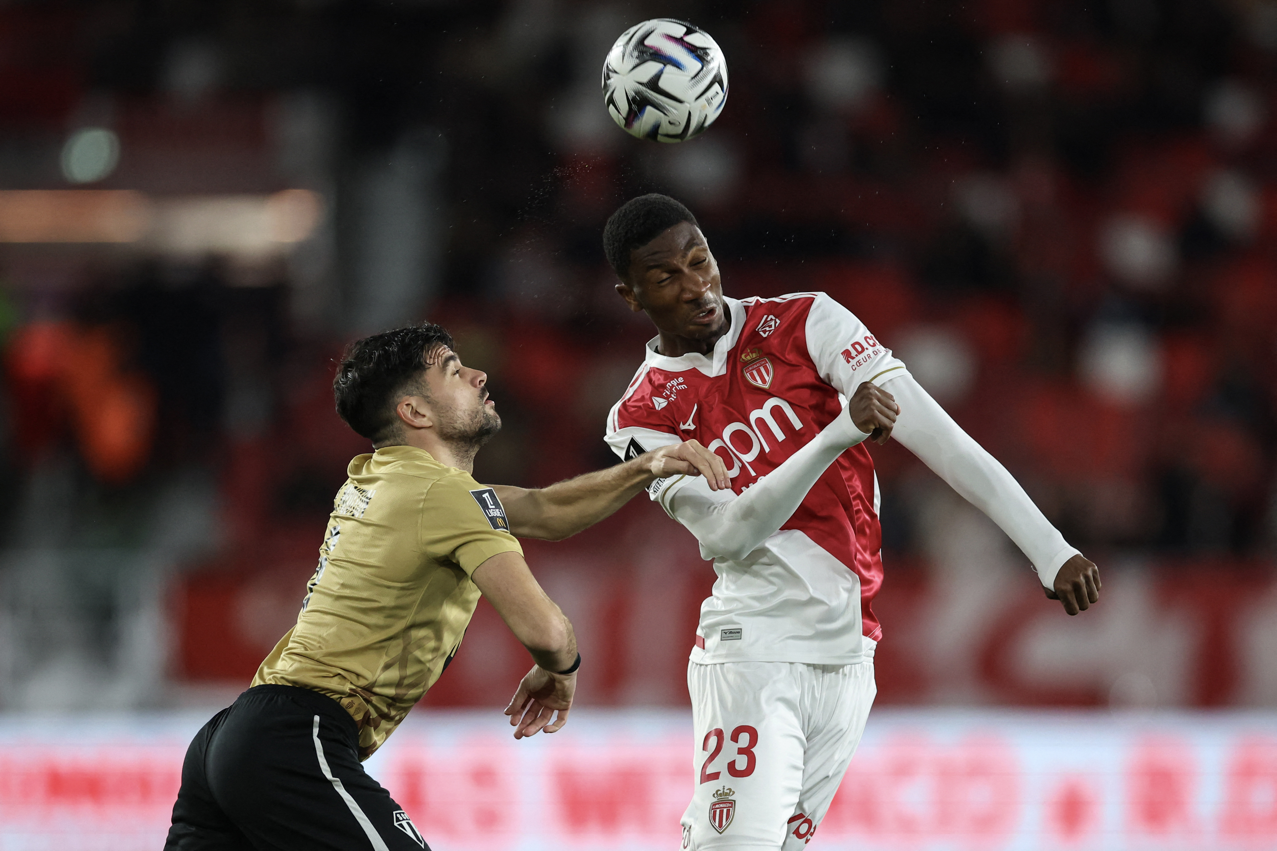 Monaco's French midfielder #23 Aladji Bamba (R) fights for the ball with Angers' French midfielder #06 Louis Mouton (L) during the French L1 football match between AS Monaco and SCO Angers at the Stade Louis II in the Principality of Monaco on February 28, 2026. (Photo by Valery HACHE / AFP)