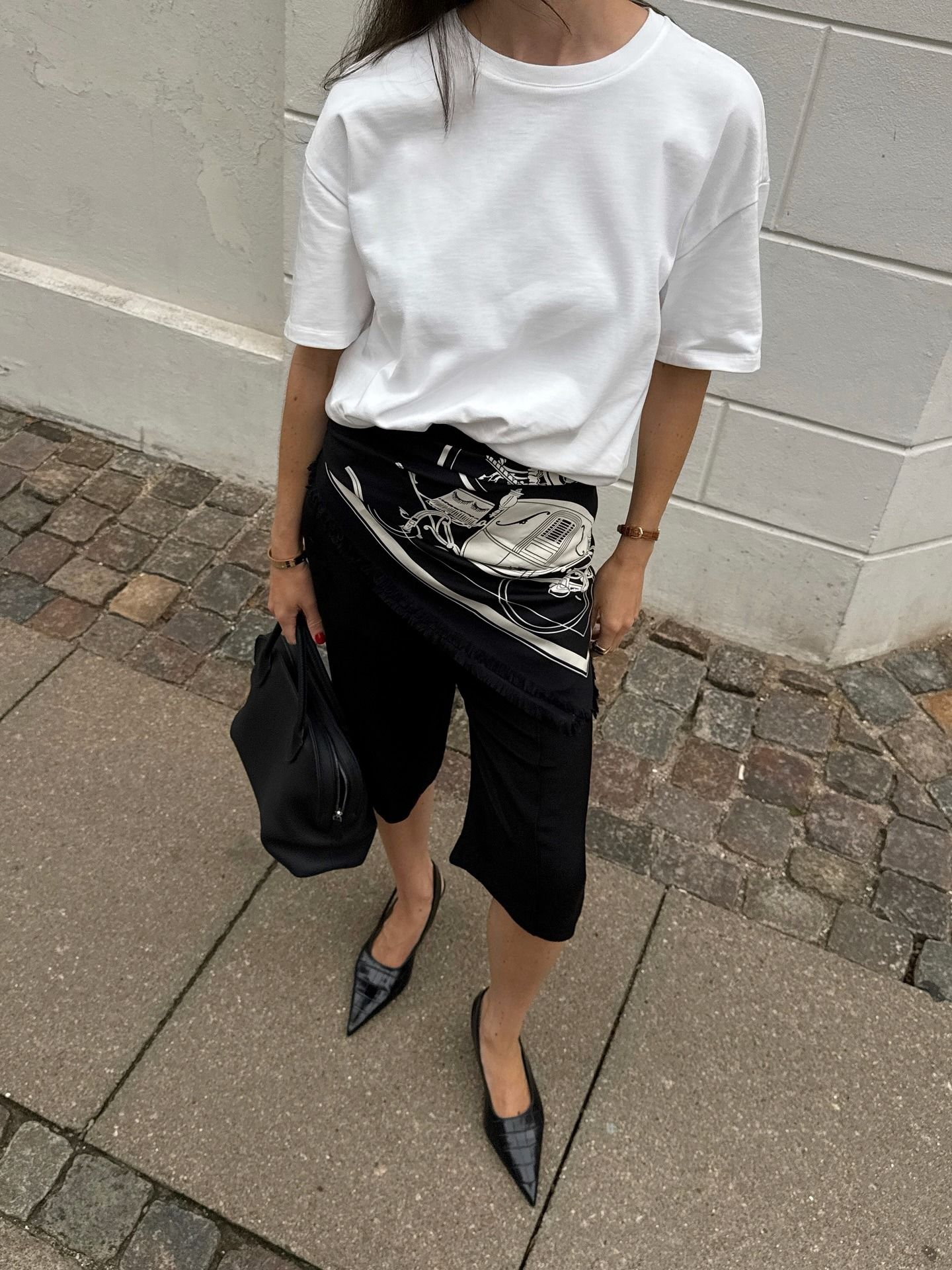 Influencer wearing croc-embossed slingback shoes