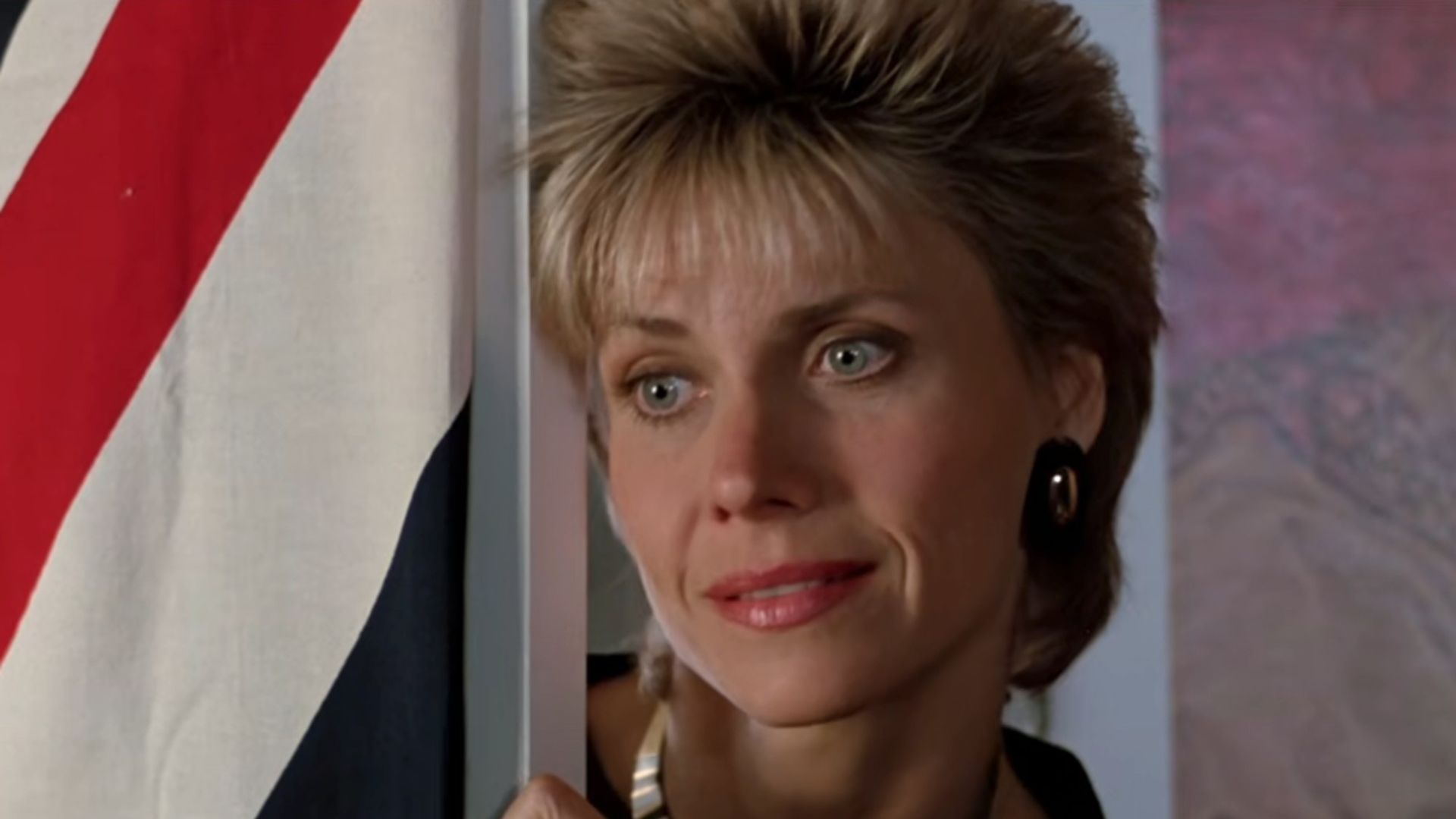 Cindy Pickett looking concerned at the door in Ferris Bueller's Day Off