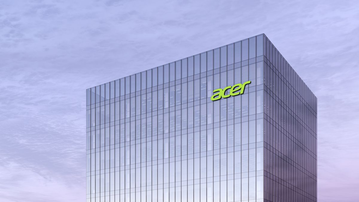 Acer logo on top of glass building with overcast sky in background