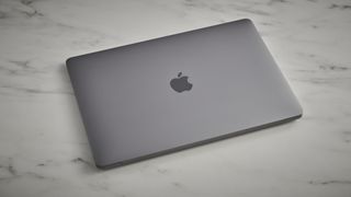 Apple MacBook Air (M1,2020) on a gray surface