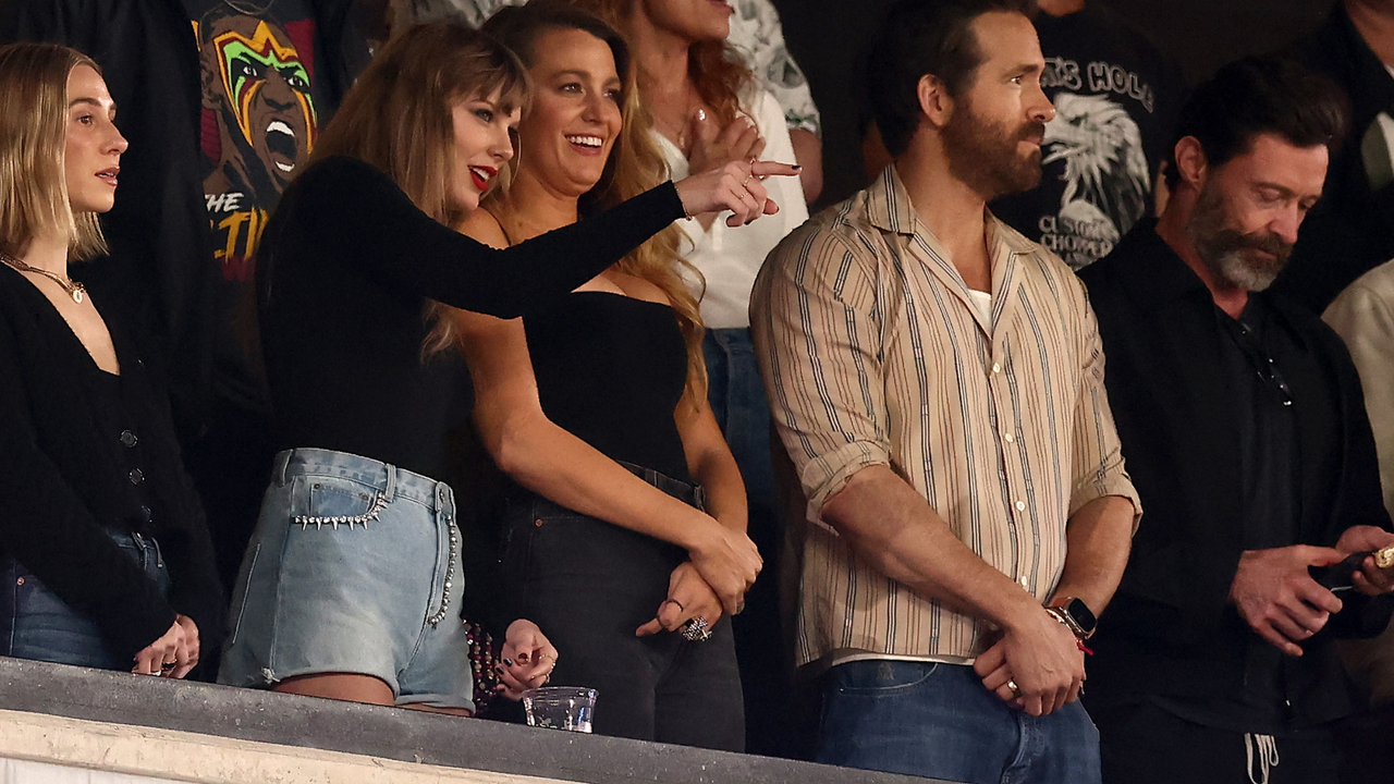 Singer Taylor Swift and Actor Ryan Reynolds look on prior to the game between the Kansas City Chiefs and the New York Jets at MetLife Stadium on October 01, 2023 in East Rutherford, New Jersey.