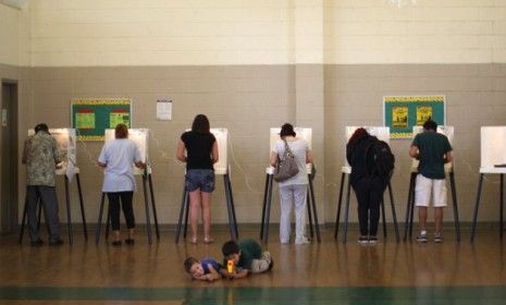 People vote at a school in Los Angeles, Calif., on Nov. 6: For millions of Americans, simply casting a ballot has become increasingly difficult.