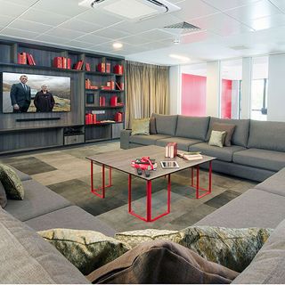 living room with grey sofa set with cushions