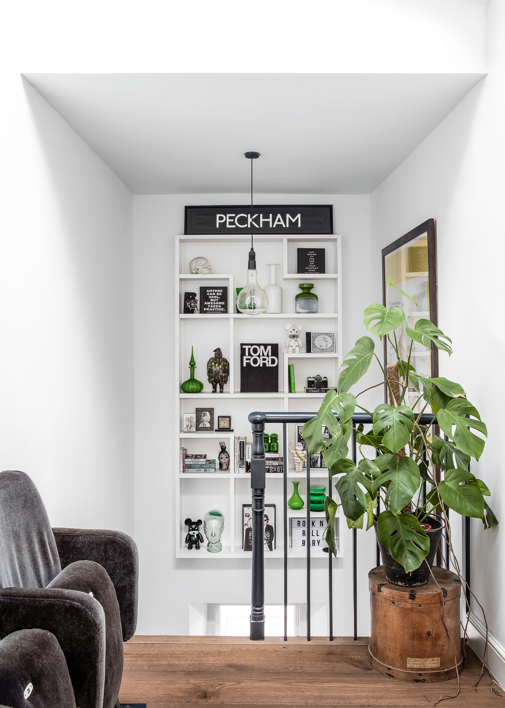 Staircase with floating shelving decorated with a green scheme