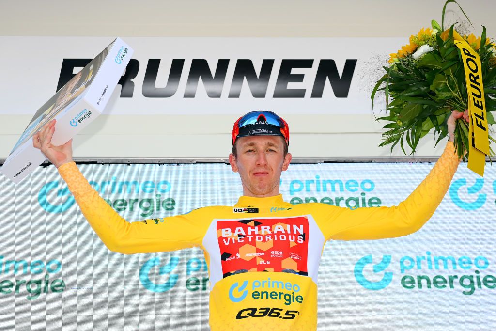 BRUNNEN SWITZERLAND JUNE 15 Stephen Williams of United Kingdom and Team Bahrain Victorious celebrates winning the yellow leader jersey on the podium ceremony after the 85th Tour de Suisse 2022 Stage 4 a 1908km stage from Grenchen to Brunnen ourdesuisse2022 WorldTour on June 15 2022 in Brunnen Switzerland Photo by Tim de WaeleGetty Images